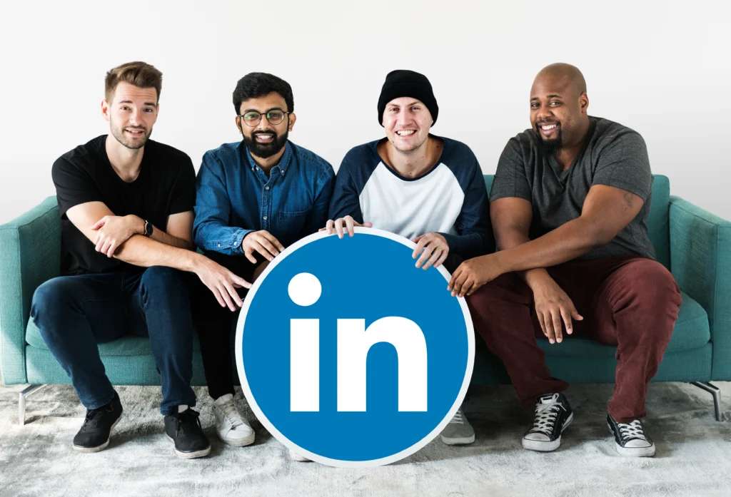 people-holding-linkedin-logo linkdin ads